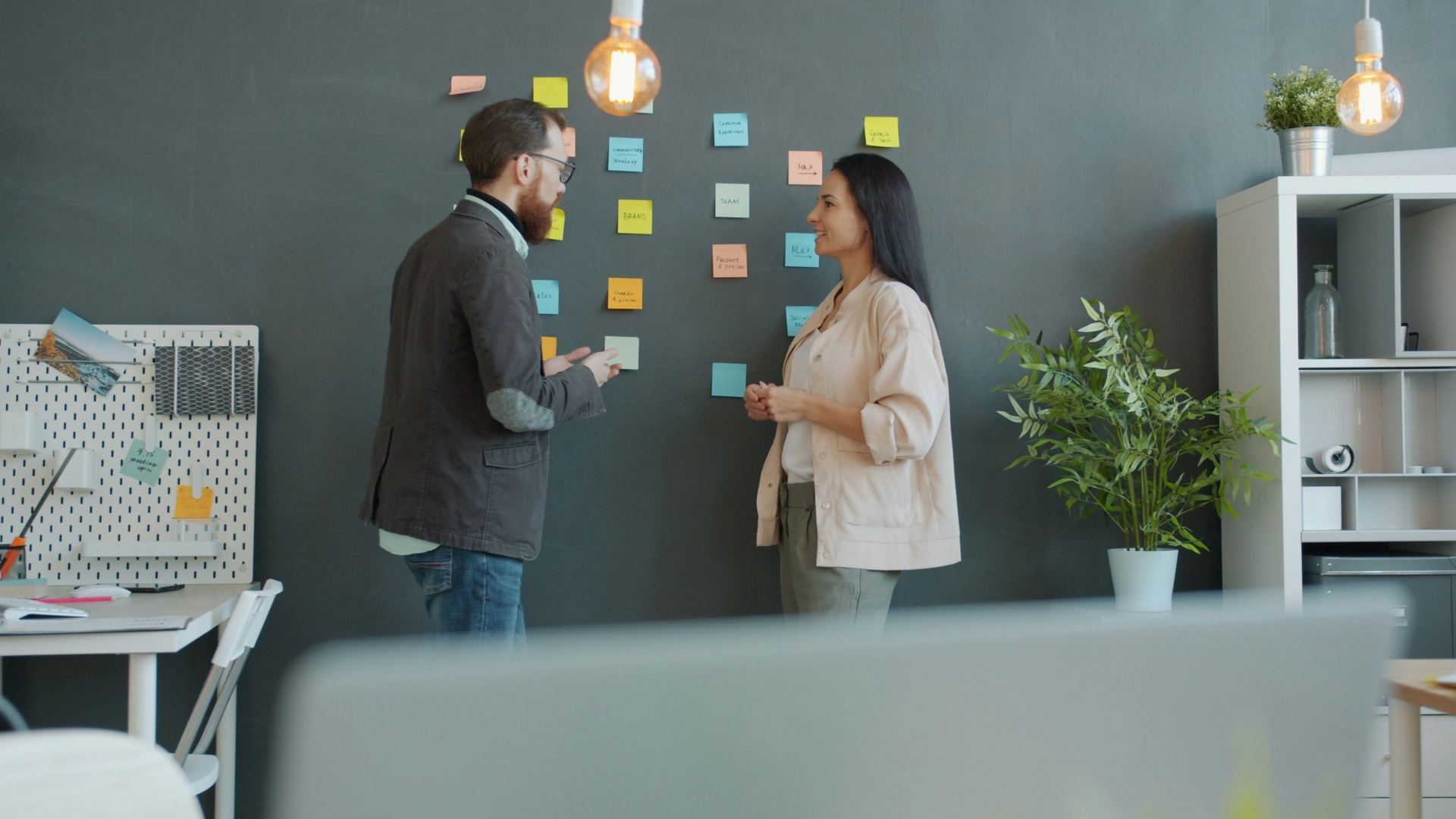Team collaborating on product strategy with sticky notes
